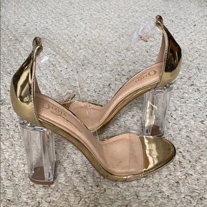 Gold and clear heels